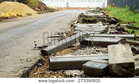 Broken Freshly Dug Up Old Curbstones With Pieces Of An Asphalt And Earth Lying On The Road In Moscow