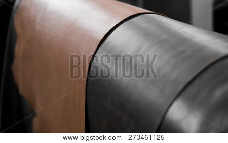 Different Pieces Of Leather In A Rolls. The Pieces Of The Colored Leathers. Rolls Of Natural Brown A
