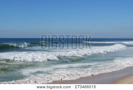 Rough Waves Touching Coast Of Portugal In Autumn