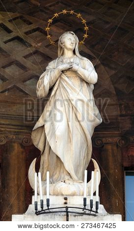 MODENA, ITALY - JUNE 04: Virgin Mary statue on Clock tower, Modena town Hall on Piazza Grande, a UNESCO World heritage site, Modena, Italy on June 04, 2017.