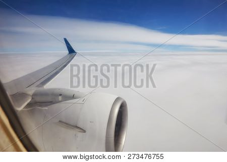 View Of Beautiful Cloud And Wing Of Airplane From Window