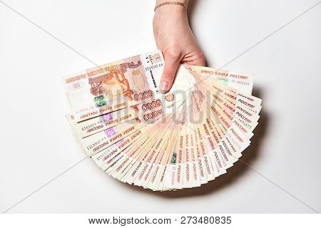 It Is A Lot Of Rubles In A Hand On A White Background. Finance Concept. Five Thousand Bills