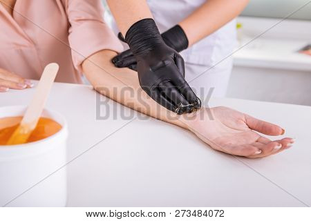 Businesswoman Wearing Beige Blouse Enjoying Painless Depilation