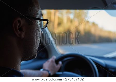 Man Driving Car At Countryside. Insight View. He Use Glasses.