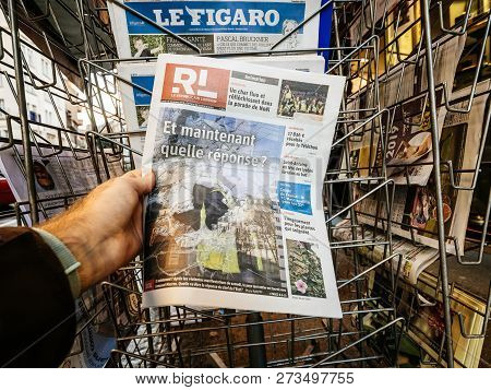 Paris, France - Dec 10, 2018: Newspaper Stand Kiosk Stand Selling Press With Man Hand Buying Le Repu