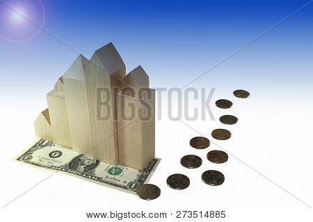 Currency Money Dollar On Which Items Are Located, Toy Houses Skyscrapers, Manetes As A Concept Of Th