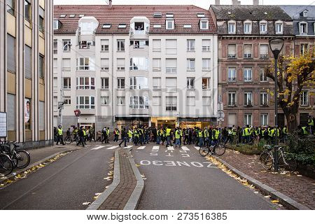 Strasbourg, France - Dec 8, 2018: Green Yellow Wests Yelling On Street Macron Demission Macron Resig