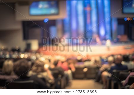 Filtered Image Blurry Background Rear View Audience At Bible Church With Preacher On Stage