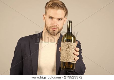Man Hold Bottle Of Wine , Alcohol. Macho With Bottle, Bad Habits. Sommelier Or Degustator With Wine,