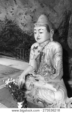 Black And White Picture Of Buddha Statue Sitting In Meditation Position  Inside Of Kaw Ka Thaung Cav