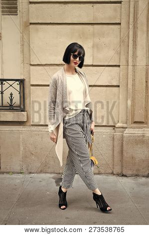 Woman With Stylish Short Brunette Hair And Red Lips. Girl In Fashionable Glasses With Bag, France. P