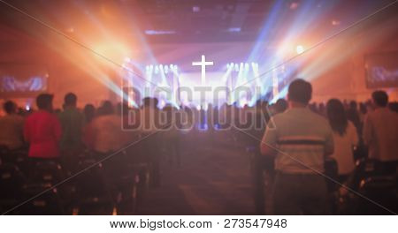 Christmas Concept: Blurred Christian Congregation Worship God Together In Church Hall In Front Of Mu