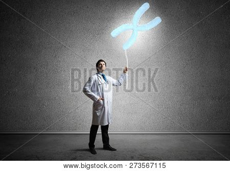 Conceptual Image Of Successful And Young Doctor In White Uniform Interracting With Dna Structure Whi