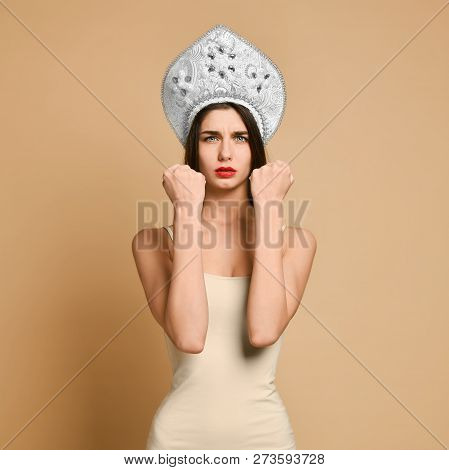 Cute Woman Shows Fist At Camera, Threatens You About Something, Has Displeased Sullen Facial Express