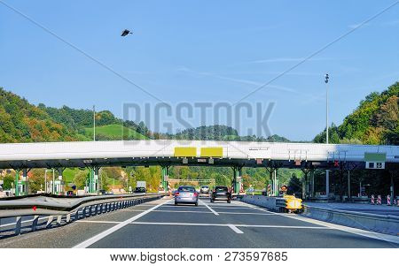 Cars At Toll Booth With Blank Signs On The Road, In Slovenia.