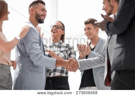 An attractive, diverse business team meeting as a grou