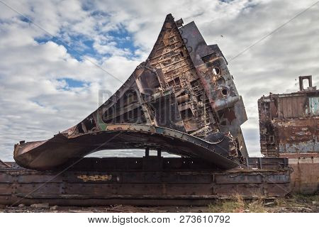 Huge Rusty Pieces Of Decommissioned Marine Ship That Was Cut And Left On The Shore.