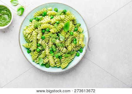 Tasty Appetizing Italian Pasta Al Bronzo With Pesto Sauce, Green Pea, Basil And Cheese Served On Pla