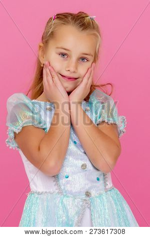 Beautiful Little Girl On A Pink Background. Concepts Style And Fashion, Happy Childhood.
