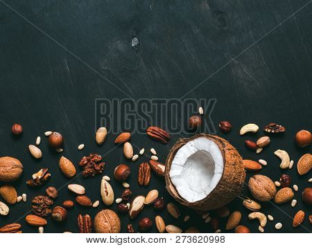 Background Of Mixed Nuts - Coconut, Hazelnuts, Walnuts, Almonds, Pecan, Pistachio, Brazil Nut, Pine 