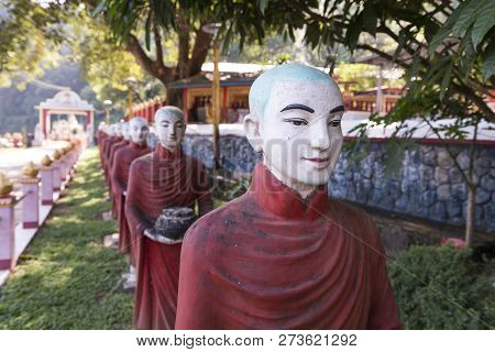 Hpa-an, Myanmar - 19 November, 2018: Horizontal Picture Of Many Aligned Monks Statues At Kaw Ka Thau