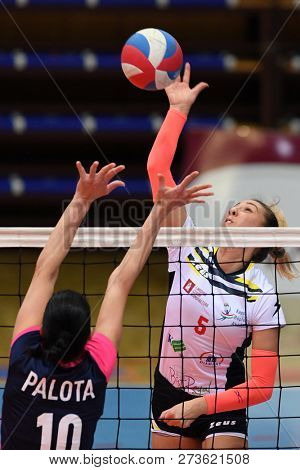 KAPOSVAR, HUNGARY â DECEMBER 2, 2018: Nevena Iricanin (white 5) in action at a Hungarian National Championship volleyball game between Kaposvar (white) and Palota VSN (blue) in Sportcsarnok Kaposvar.