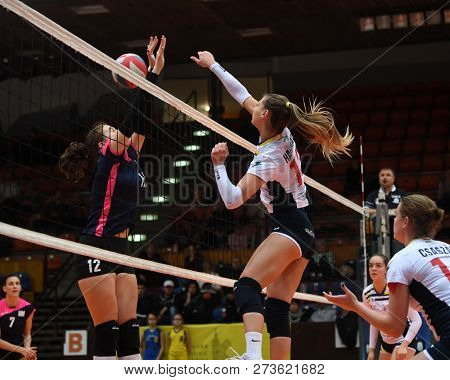 KAPOSVAR, HUNGARY â DECEMBER 2, 2018: Zsofia Harmath (white 13) in action at a Hungarian National Championship volleyball game between Kaposvar (white) and Palota VSN (blue) in Sportcsarnok Kaposvar.