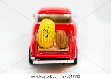 Two Grapes Sitting In The Back Of A Pickup Truck