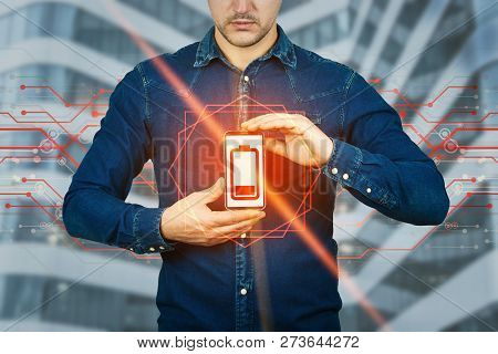 Serious Casual Man Holding Mobile Phone To Chest Showing Red Low Power Battery Symbol Hologram. Busi