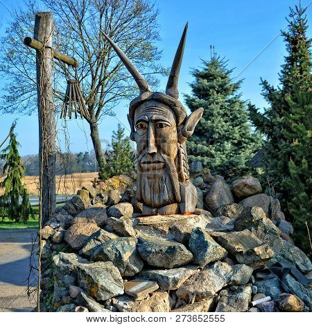 Pagan Idol. Decoration Of Exterior Of Hotel Pajero. Polish Motel Is Located 20 Km From The Border Wi