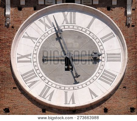 VERONA, ITALY - MAY 27: Clock on Torre dei Lamberti - medieval tower of the Lamberti XI century - 84 m. Piazza delle Erbe, UNESCO world heritage site  in Verona, Italy, on May 27, 2017.
