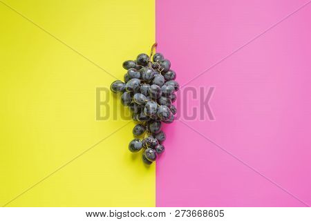 Top View Of Flat Lay Of Bunch Of Grapes On Double Color Sirface Background