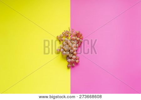 Top View Of Flat Lay Of Bunch Of Grapes On Double Color Sirface Background