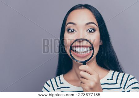 Close-up Portrait Of Nice Attractive Funny Straight-haired Lady In Striped Pullover Holding Loupe Sh