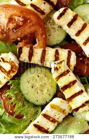 Plate Of Slad With Halloumi, Tomato And Cucumber