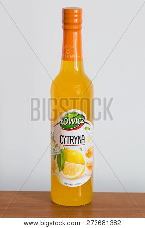 Pruszcz Gdanski, Poland - December 12, 2018: Lowicz Lemon Juice In A Glass Bottle On Wooden Table.