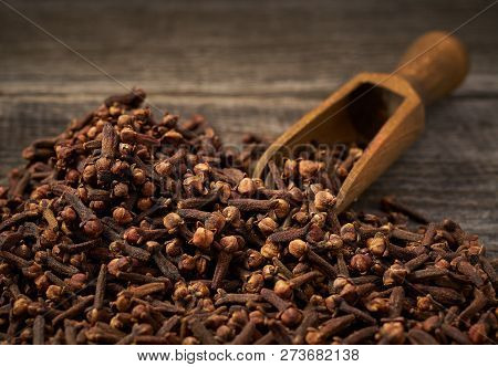 Dried Cloves In A Wooden Shovel Close-up