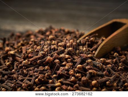 Dried Cloves In A Wooden Shovel Close-up