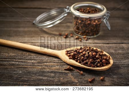 Dried Cloves In A Wooden Spoon Close-up