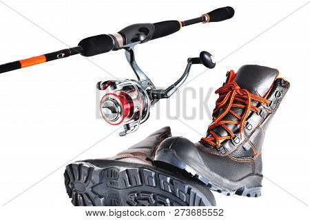 Spinning With A Reel And Off-road Shoes With Orange Laces On A White Background, Isolate