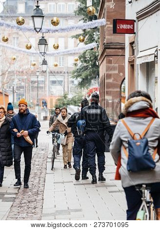 Strasbourg, France - Dec 11, 2018: Rear View Of French Police Officers Securing Rue De Loutre City C