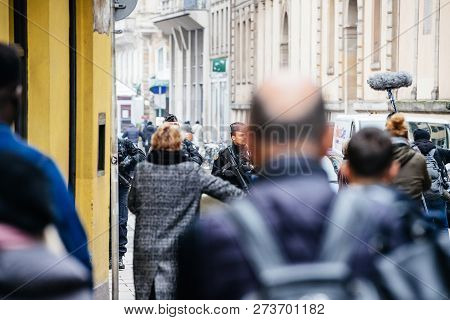 Strasbourg, France - Dec 11, 2018: Rear View Of French Police Officers Securing Rue De Loutre City C