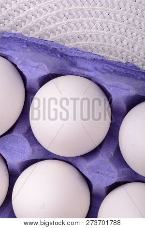 Close Up Of Chicken Eggs, Blue Package With Eggs, Eggs In Old Tray