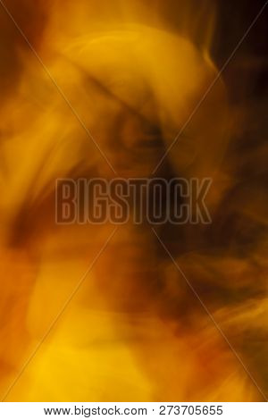 Abstract Yellow And Red Fumes On Black Background