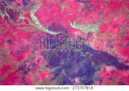 background of textured handmade Thai marbled momi mulberry paper with random pattern