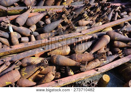 Closeup Of Disarmed War Salvage, Rusty Munitions, Shell Casings, Bombs, Bombies, Unexploded Ordnance