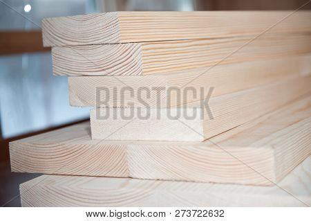Wood Boards. Timber In Stock. Many New Boards In Stock. Planed Boards Are Stacked.