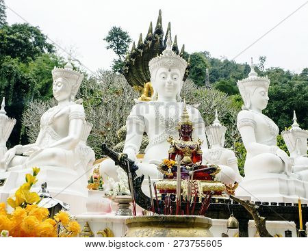 White Anciant Figures Of Buddhist Statues And Large Mountains On The Background In The Chiang Dao Ca