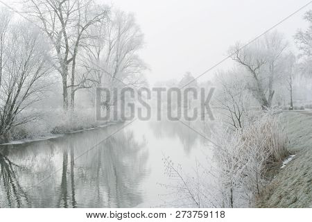 River Landscape With Fog And Rime, The River Nidda In Frankfurt, Germany.