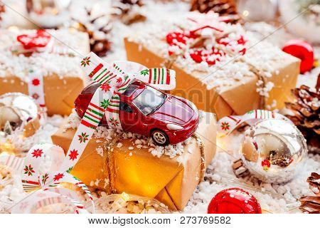Christmas And New Year Background With Toy Car Present With Ribb
